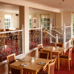 The Brasserie restaurant at Mercure Bolton Georgian House Hotel, red carpet, red wooden chairs