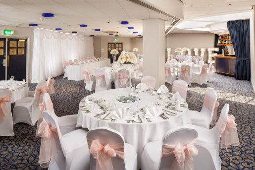 The Rivington Park Suite at Mercure Bolton Georgian House Hotel ready for a Wedding Breakfast with round tables.
