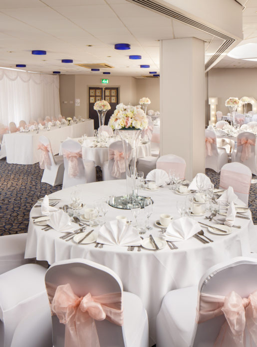 The Rivington Park Suite at Mercure Bolton Georgian House Hotel ready for a Wedding Breakfast with round tables.