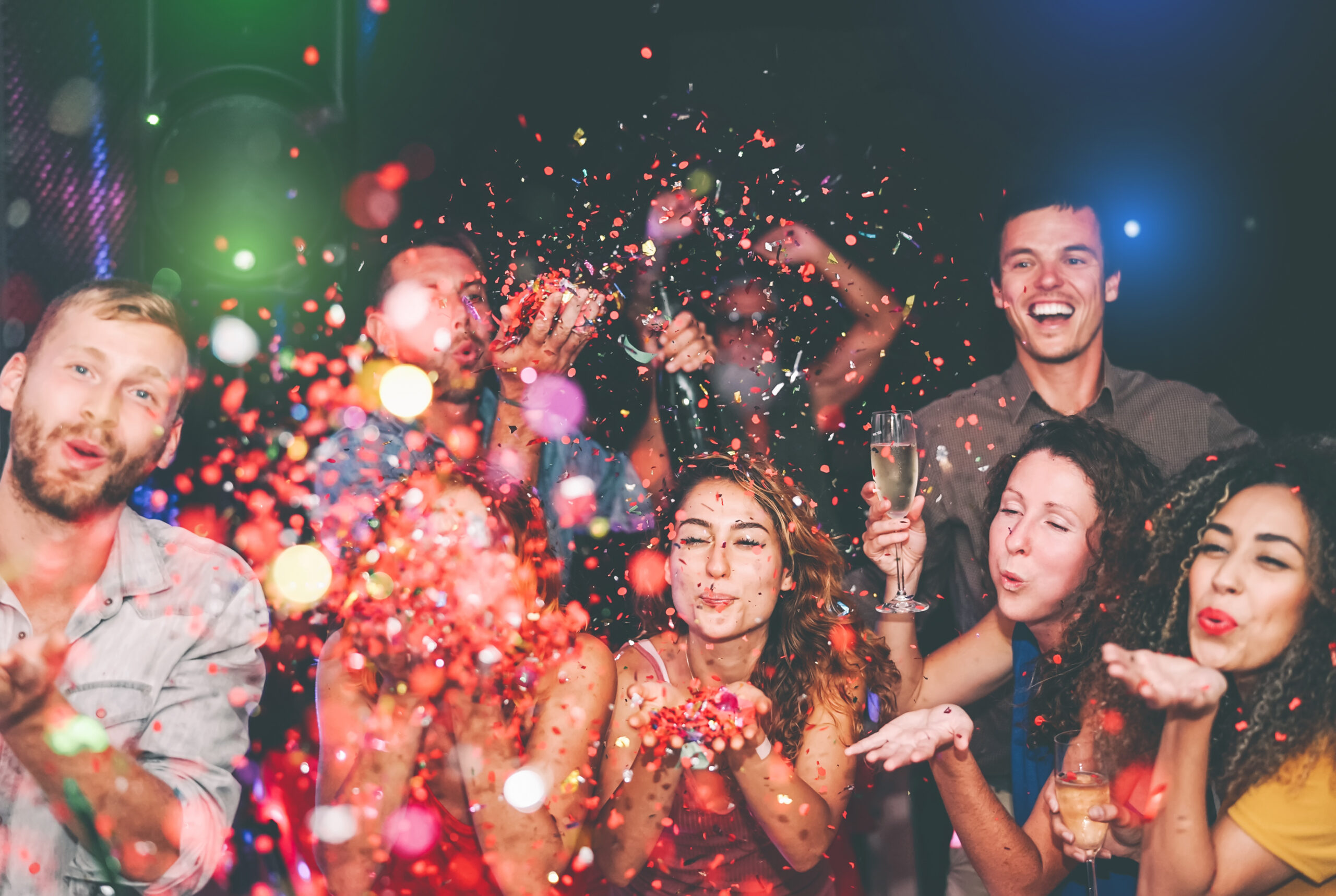 Happy,Friends,Doing,Party,Throwing,Confetti,In,Nightclub,-,Group